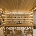 18 Interior Projects that Use Open Storage to Hide Clutter in Plain Sight - Image 5 of 19